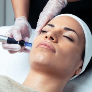 Cosmetologist making mesotherapy injection with dermapen on face for rejuvenation on the spa center.
