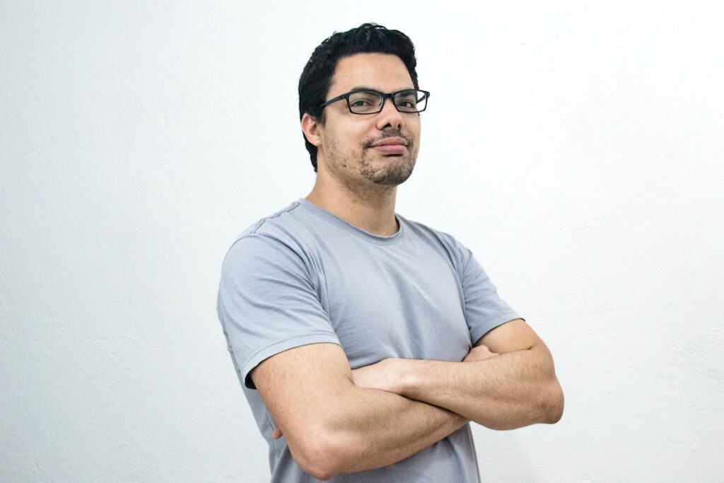 man wearing eyeglasses smiling
